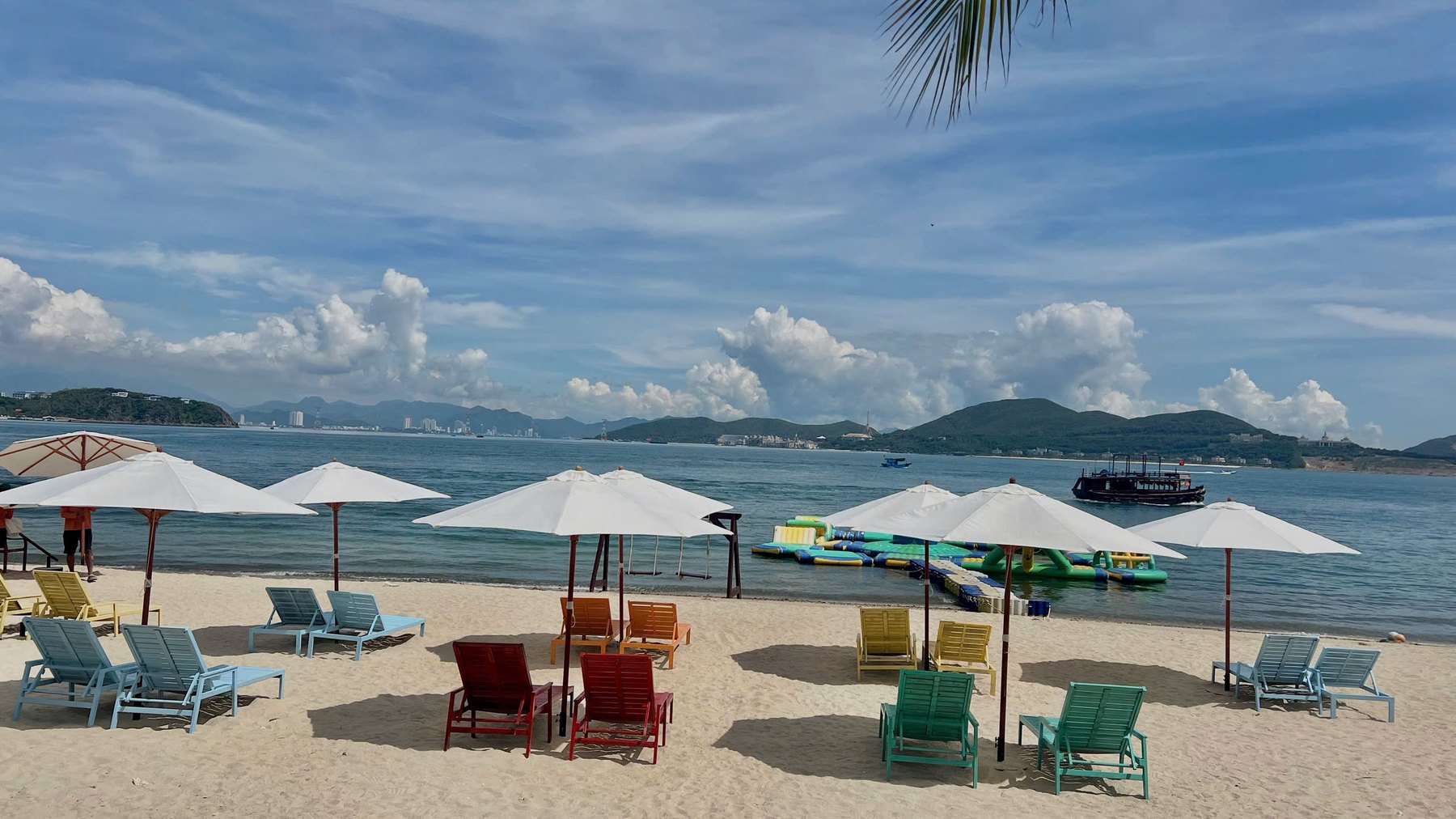 Hon Tam beach with loungers, umbrellas and calm sea